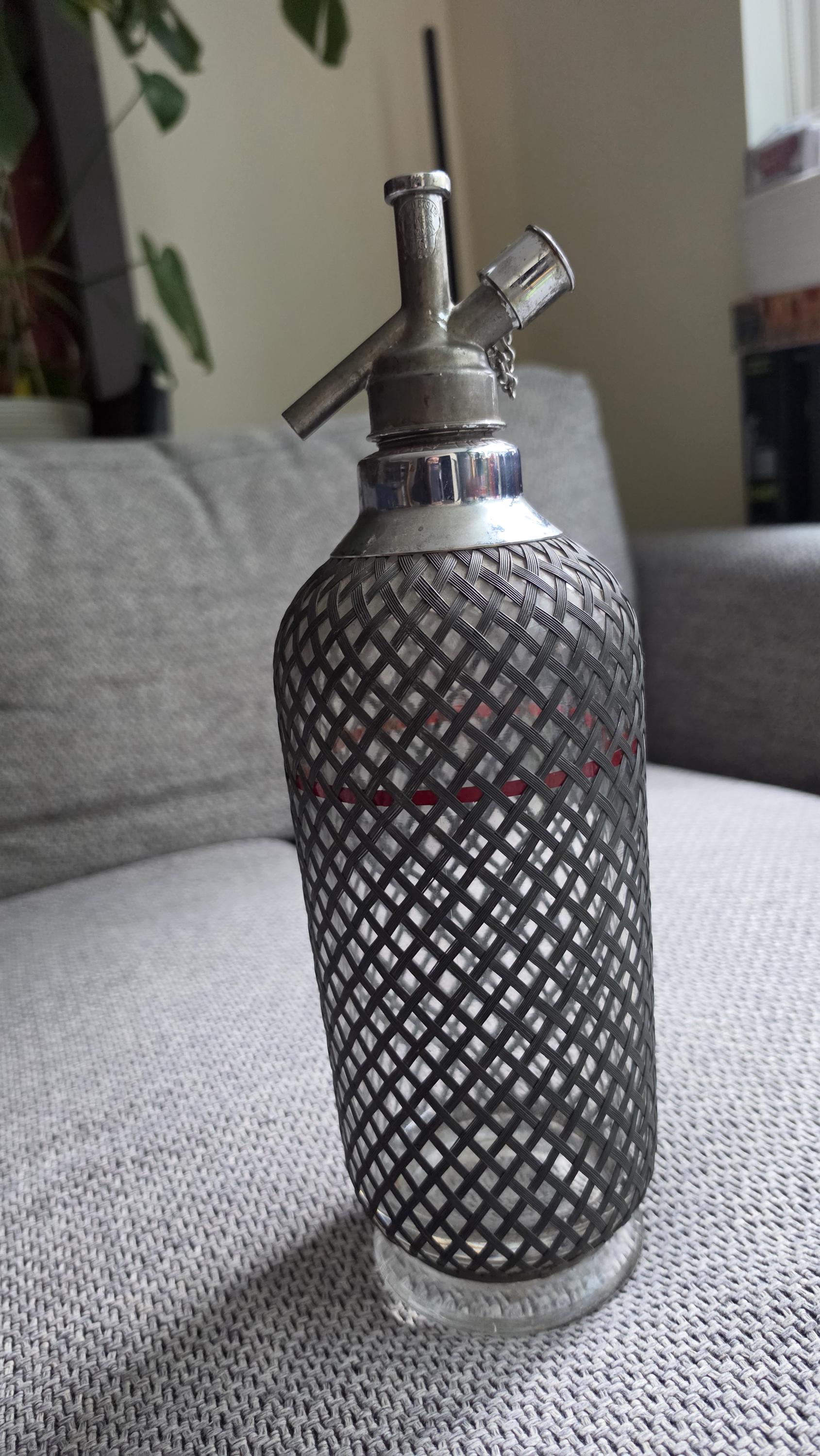 Vintage Soda Siphon Bottle, Mid Century Seltzer Syphon with Metal Mesh Cover, Bar Decor, Industrial Glass Bottle