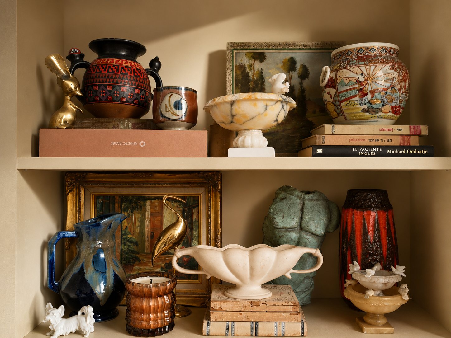 Curated shelf of sourced vintage pottery, brass and glassware